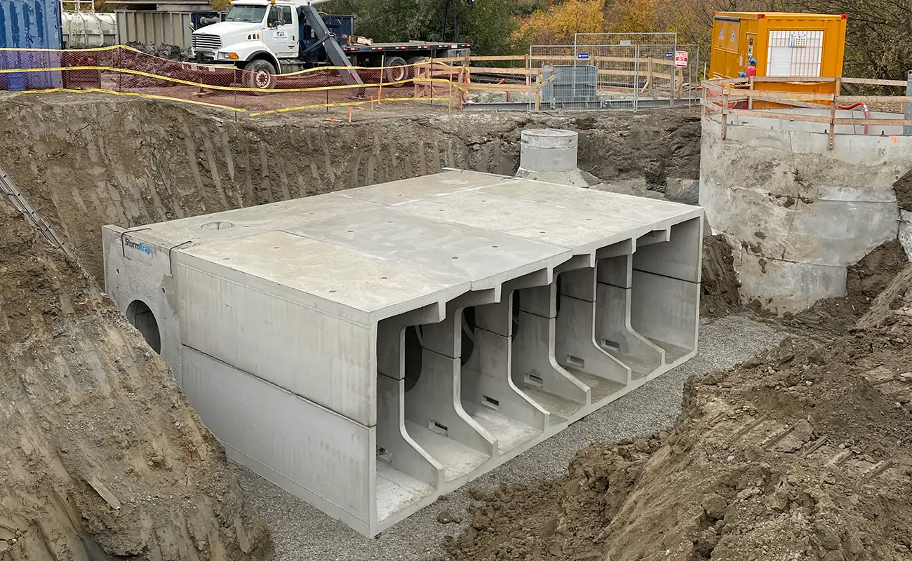 StormTrap DoubleTrap tall storage tank units placed in excavation pit at SXSW Condos, Vaughan Ontario